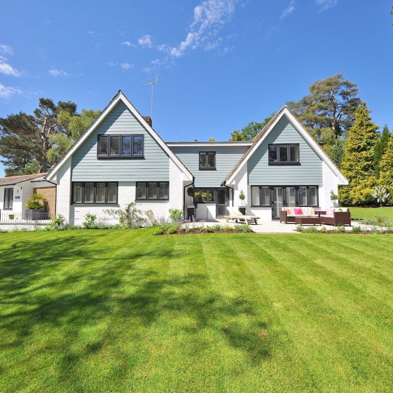 house with green grass